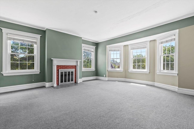 20 The Blvd, New Rochelle, NY 10801 - unfurnished living room featuring carpet flooring, plenty of natural light, a fireplace, and ornamental molding