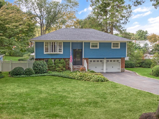 15 Eastover Dr, East Northport, NY 11731 - bi-level home featuring an attached garage, asphalt driveway, brick siding, and roof with shingles