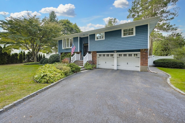 15 Eastover Dr, East Northport, NY 11731 - bi-level home featuring driveway and an attached garage