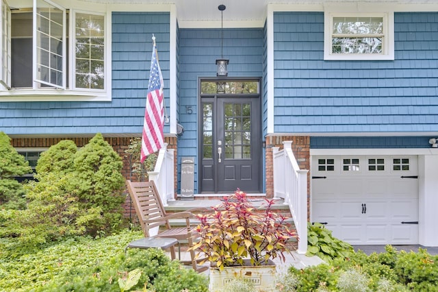 15 Eastover Dr, East Northport, NY 11731 - property entrance with a garage and covered porch