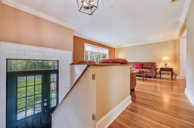 15 Eastover Dr, East Northport, NY 11731 - entryway featuring light wood-style floors, crown molding, and a chandelier