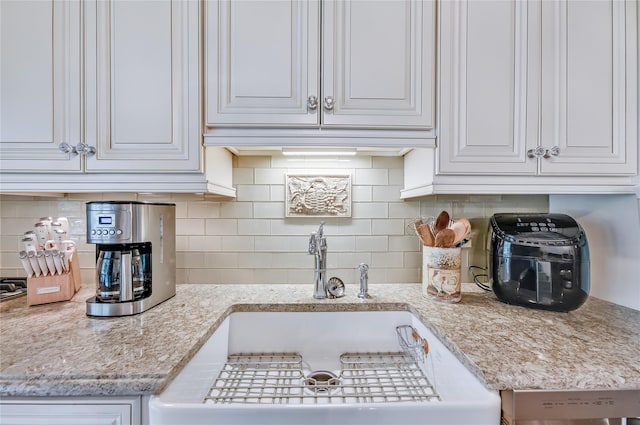 15 Eastover Dr, East Northport, NY 11731 - kitchen featuring white cabinets and decorative backsplash