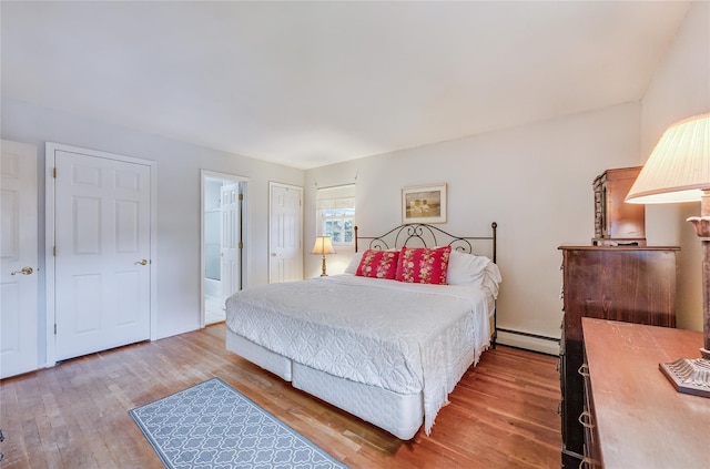 15 Eastover Dr, East Northport, NY 11731 - bedroom with a baseboard heating unit and wood finished floors
