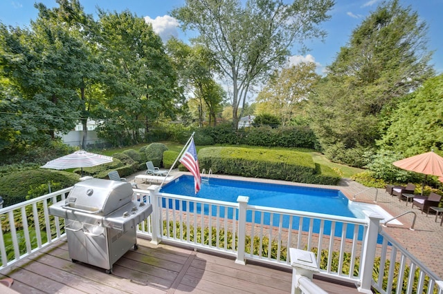 15 Eastover Dr, East Northport, NY 11731 - swimming pool with a grill, view of wooded area, a patio, and a deck