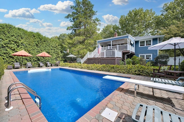 15 Eastover Dr, East Northport, NY 11731 - outdoor pool featuring stairway, a patio, a diving board, and a deck