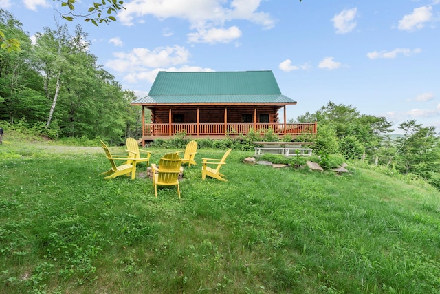 892 Durham Rd, Gilboa, NY 12076 - rear view of property with log exterior, a metal roof, and covered porch