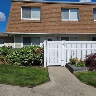 172 Storm Dr, Holtsville, NY 11742 - townhome / multi-family property with a gate