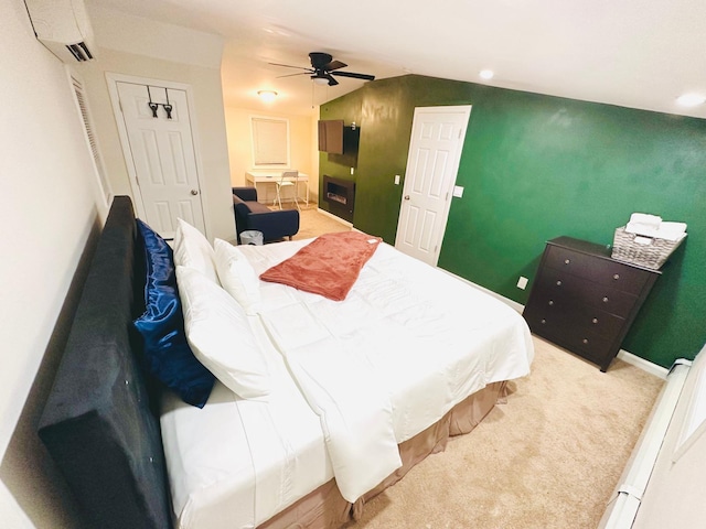 21 Pennwood Dr, Mastic Beach, NY 11951 - carpeted bedroom with a wall unit AC, vaulted ceiling, and ceiling fan