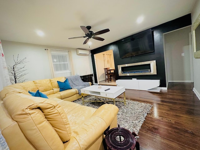 21 Pennwood Dr, Mastic Beach, NY 11951 - living room featuring a wall mounted air conditioner, a ceiling fan, hardwood / wood-style flooring, a glass covered fireplace, and recessed lighting