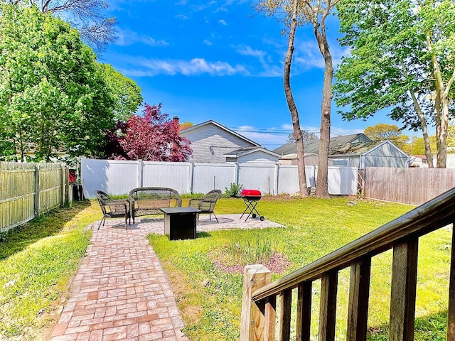 21 Pennwood Dr, Mastic Beach, NY 11951 - fenced backyard featuring a fire pit and a patio area