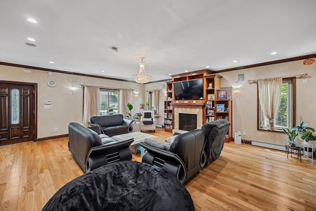 38-16 220th St, Bayside, NY 11361 - living room with crown molding, light wood-style flooring, baseboard heating, recessed lighting, and a fireplace