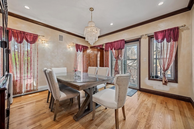 38-16 220th St, Bayside, NY 11361 - dining room with a chandelier, light wood-type flooring, plenty of natural light, ornamental molding, and recessed lighting