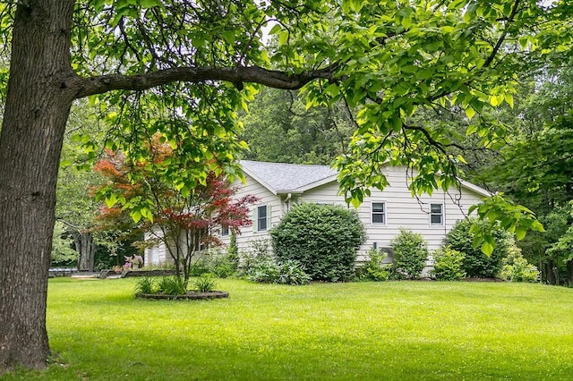 4 Mary Ann Ave, Saugerties, NY 12477 - view of property exterior with a yard and roof with shingles