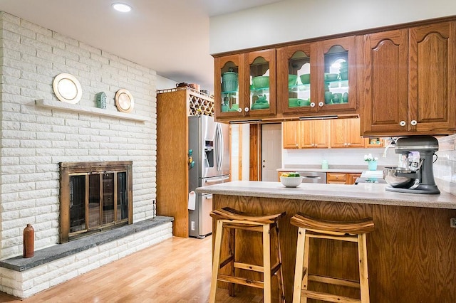 4 Mary Ann Ave, Saugerties, NY 12477 - kitchen with appliances with stainless steel finishes, a peninsula, glass insert cabinets, and light countertops