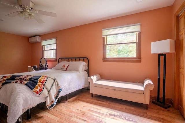 4 Mary Ann Ave, Saugerties, NY 12477 - bedroom featuring a wall unit AC, wood finished floors, and ceiling fan