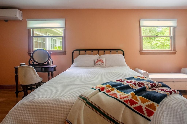 4 Mary Ann Ave, Saugerties, NY 12477 - bedroom featuring a wall unit AC, wood finished floors, and multiple windows