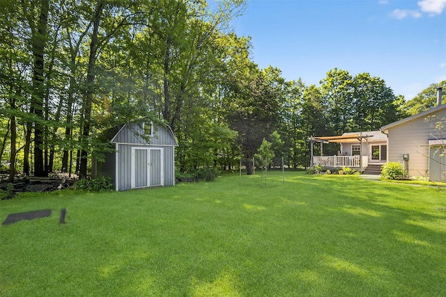 4 Mary Ann Ave, Saugerties, NY 12477 - view of grassy yard with a storage unit and a deck