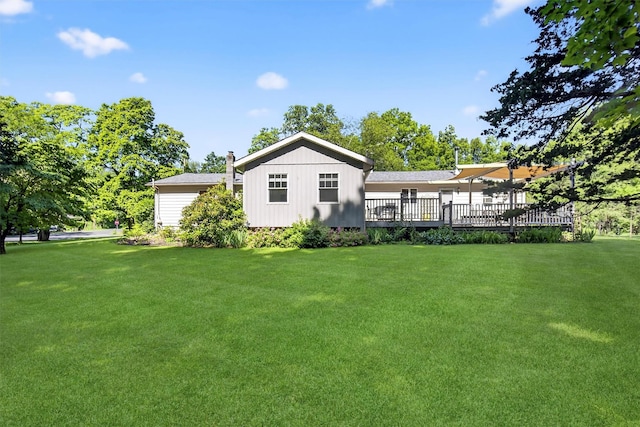 4 Mary Ann Ave, Saugerties, NY 12477 - back of house with a lawn, a wooden deck, and a chimney
