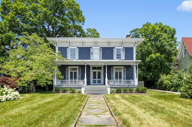 103 Albany Ave, Kingston, NY 12401 - italianate house featuring a chimney, a front lawn, and covered porch
