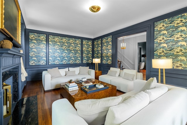 103 Albany Ave, Kingston, NY 12401 - living room with hardwood / wood-style flooring, a decorative wall, a fireplace, wallpapered walls, and stairs