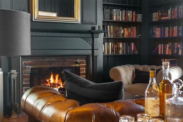 103 Albany Ave, Kingston, NY 12401 - living area featuring a warm lit fireplace