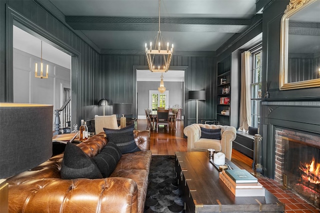 103 Albany Ave, Kingston, NY 12401 - living area featuring a chandelier, a fireplace, wood finished floors, a decorative wall, and beamed ceiling