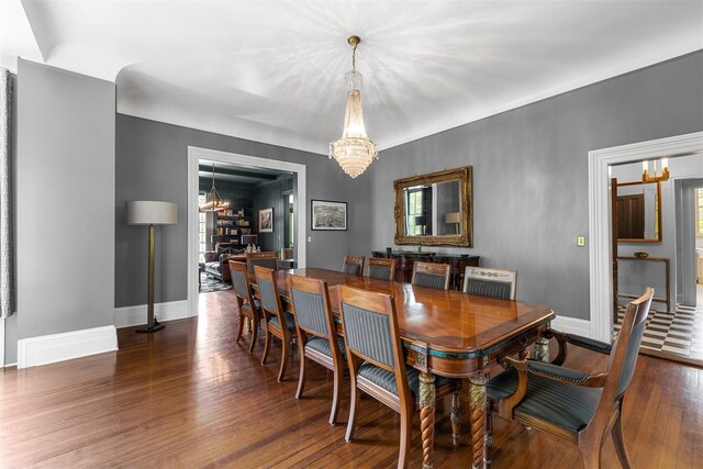 103 Albany Ave, Kingston, NY 12401 - dining room featuring a chandelier, wood finished floors, and healthy amount of natural light