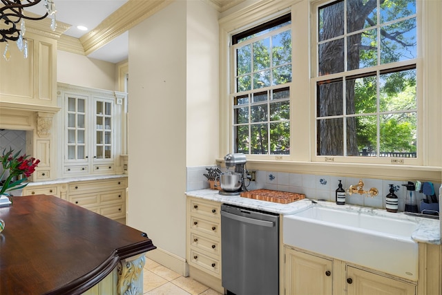 103 Albany Ave, Kingston, NY 12401 - kitchen with stainless steel dishwasher, decorative backsplash, light tile patterned flooring, glass insert cabinets, and cream cabinetry