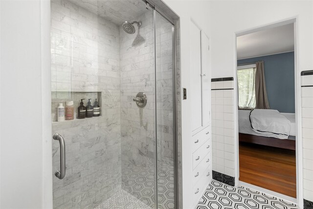 103 Albany Ave, Kingston, NY 12401 - bathroom with a stall shower, ensuite bath, and tile patterned flooring