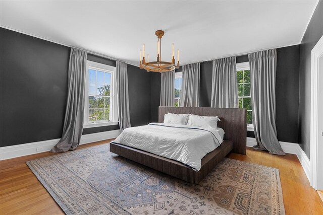103 Albany Ave, Kingston, NY 12401 - bedroom with a chandelier and wood finished floors