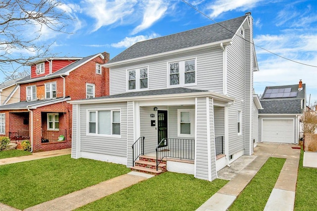 20955 112th Ave, Saint Albans, NY 11429 - view of front facade with concrete driveway, covered porch, a front lawn, and a garage