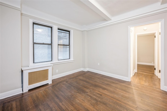 142 E 49th St Unit 4C, New York Manhattan, NY 10017 - empty room with radiator and wood finished floors
