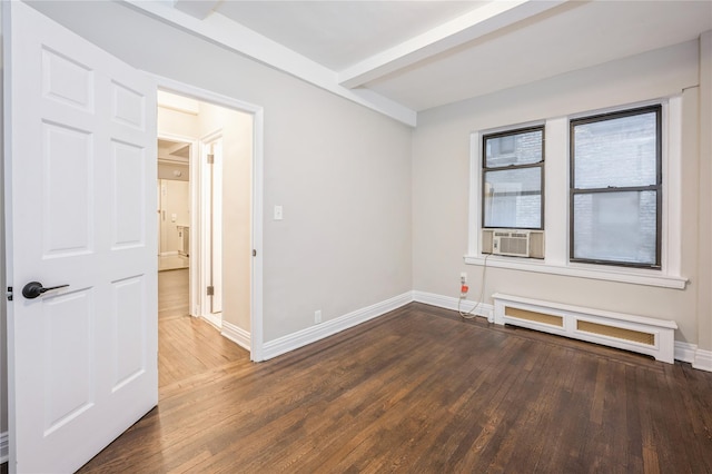 142 E 49th St Unit 4C, New York Manhattan, NY 10017 - spare room with beam ceiling, cooling unit, wood finished floors, and radiator heating unit