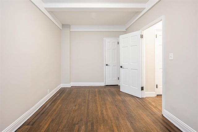 142 E 49th St Unit 4C, New York Manhattan, NY 10017 - hallway featuring dark wood finished floors and beamed ceiling