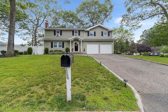 40 Ridge Haven Dr, Ridge, NY 11961 - traditional-style home featuring a chimney, a garage, and asphalt driveway
