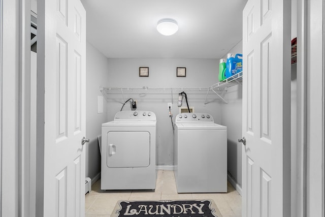 40 Ridge Haven Dr, Ridge, NY 11961 - washroom featuring washing machine and dryer, a baseboard radiator, and light tile patterned floors