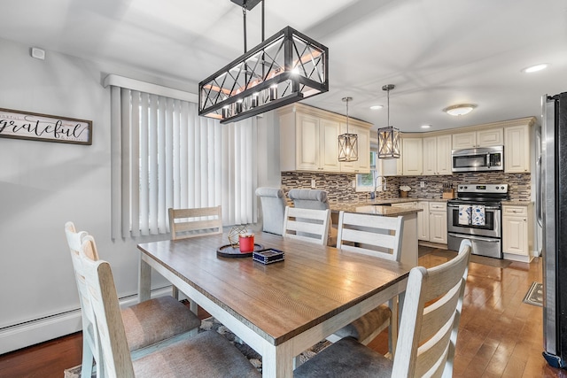 40 Ridge Haven Dr, Ridge, NY 11961 - dining area with hardwood / wood-style floors, a chandelier, and recessed lighting