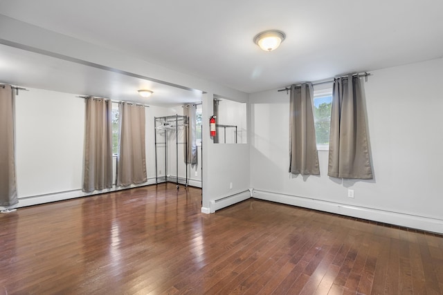 40 Ridge Haven Dr, Ridge, NY 11961 - unfurnished room featuring healthy amount of natural light, hardwood / wood-style flooring, and baseboard heating
