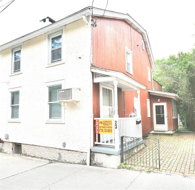 23 Kemble Ave, Cold Spring, NY 10516 - view of front of house featuring a wall mounted AC and covered porch