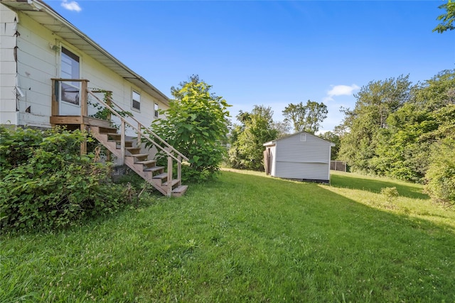 512 Riley Rd, New Windsor, NY 12553 - view of green lawn with a storage shed and stairs