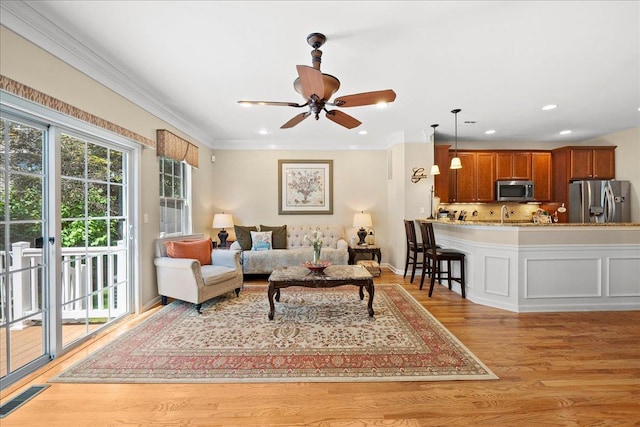102 Paget Ln, Massapequa, NY 11758 - living room with ceiling fan, light wood-style floors, recessed lighting, and ornamental molding
