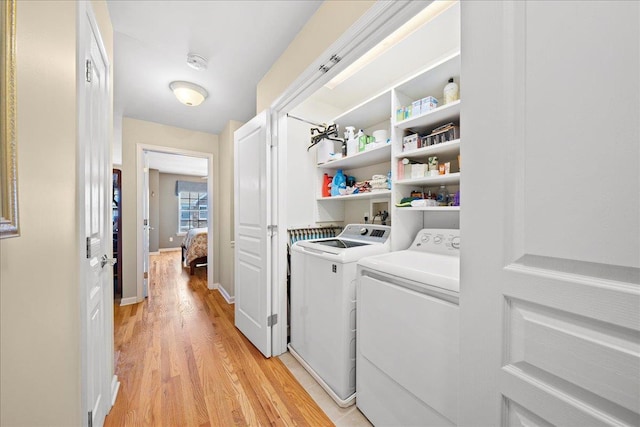 102 Paget Ln, Massapequa, NY 11758 - washroom featuring washer and dryer and light wood-style floors