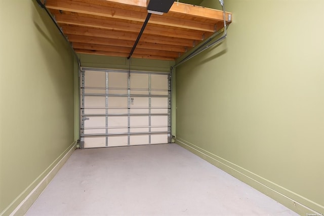 102 Paget Ln, Massapequa, NY 11758 - garage featuring baseboards and a garage door opener