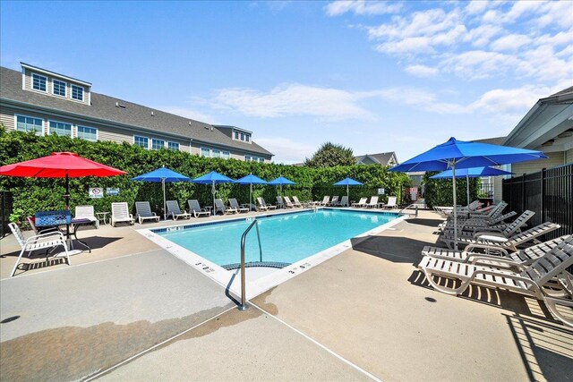 102 Paget Ln, Massapequa, NY 11758 - community pool with a patio area