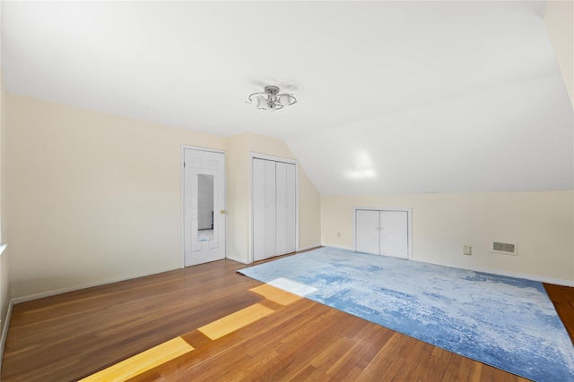 2354 128th St, College Point, NY 11356 - additional living space featuring wood finished floors and vaulted ceiling
