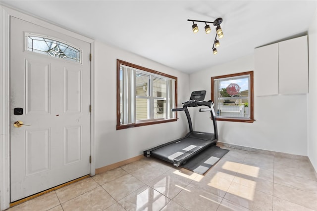 2354 128th St, College Point, NY 11356 - workout area with light tile patterned flooring and baseboards