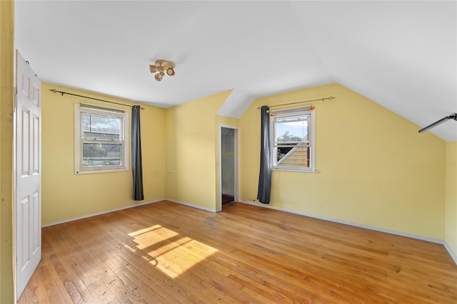 2354 128th St, College Point, NY 11356 - additional living space featuring light wood-style flooring and lofted ceiling