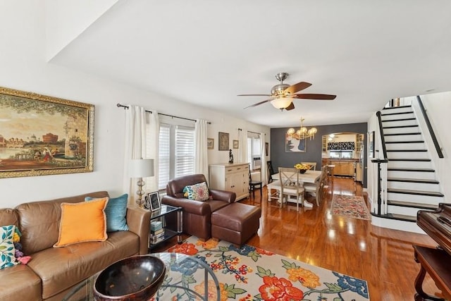 3211 204th St, Bayside, NY 11361 - living area with wood finished floors, ceiling fan, a chandelier, and stairway