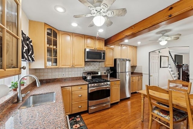 3211 204th St, Bayside, NY 11361 - kitchen featuring appliances with stainless steel finishes, a ceiling fan, light wood-style flooring, decorative backsplash, and recessed lighting