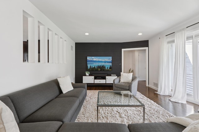 187 Thornbury Rd, Scarsdale, NY 10583 - living area featuring wood finished floors, recessed lighting, and an accent wall